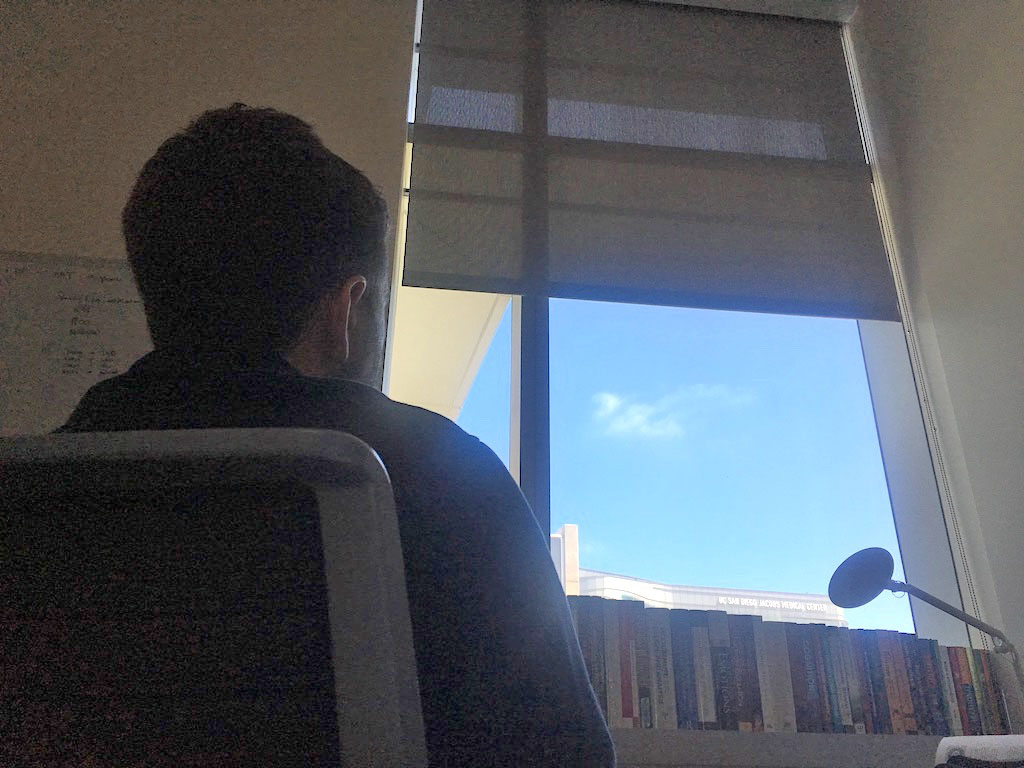 Matt sitting at desk in UCSD office